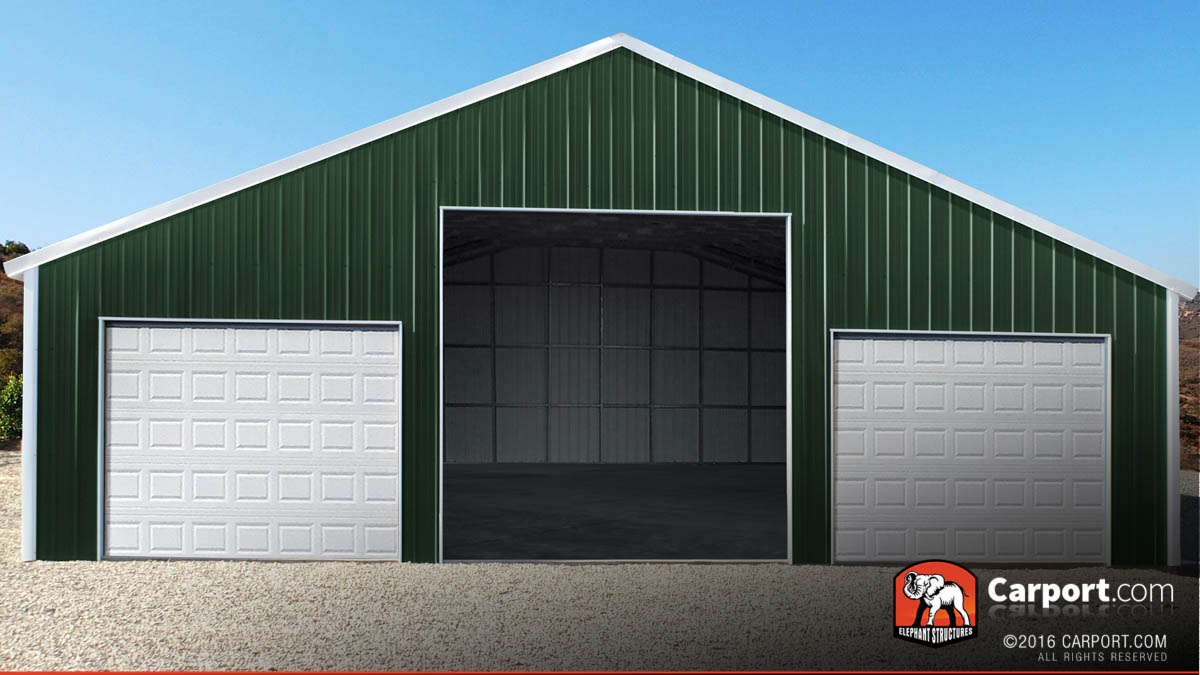 Large commercial garage with three large roll up garage doors.