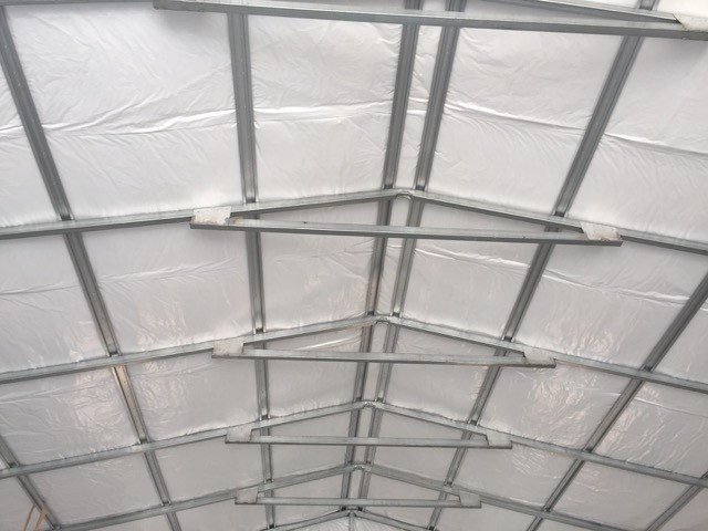 Framing of a commercial metal garage, insulation, roof.