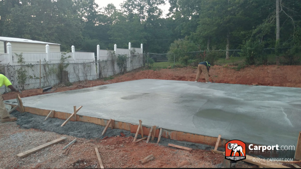 Concrete foundation is poured, smooth, and dry.