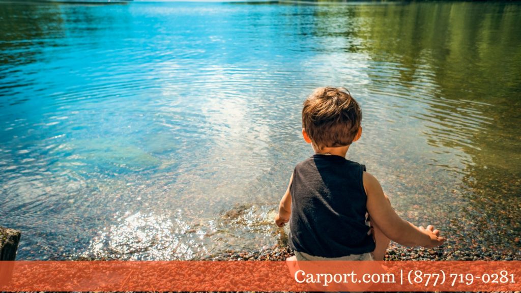 Kids playing in clean mountain lake water