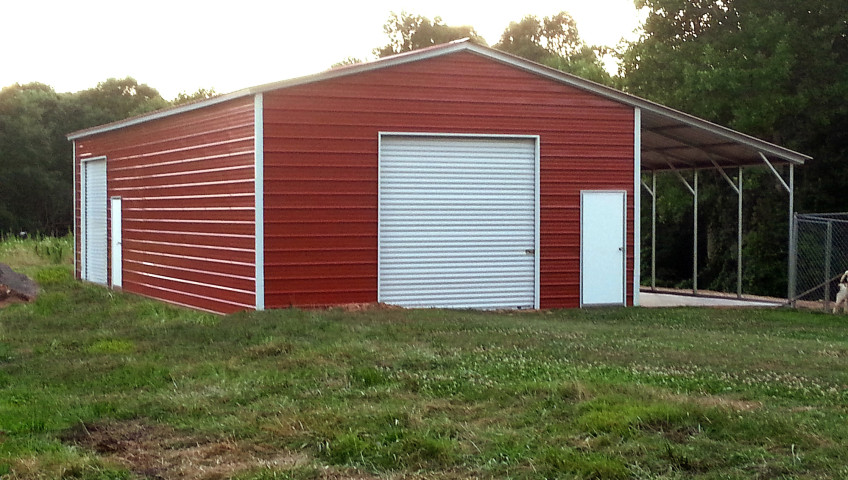 Metal building with valley style roofing and one lean to on the side.
