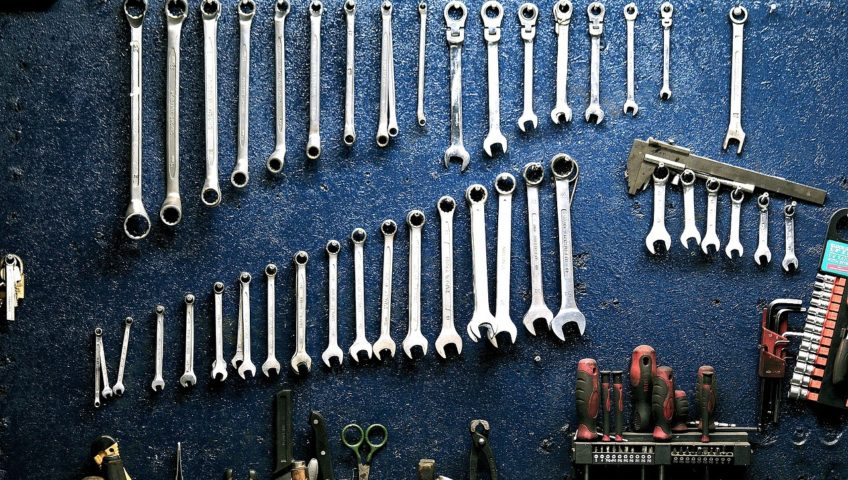 blue wall with wrenches