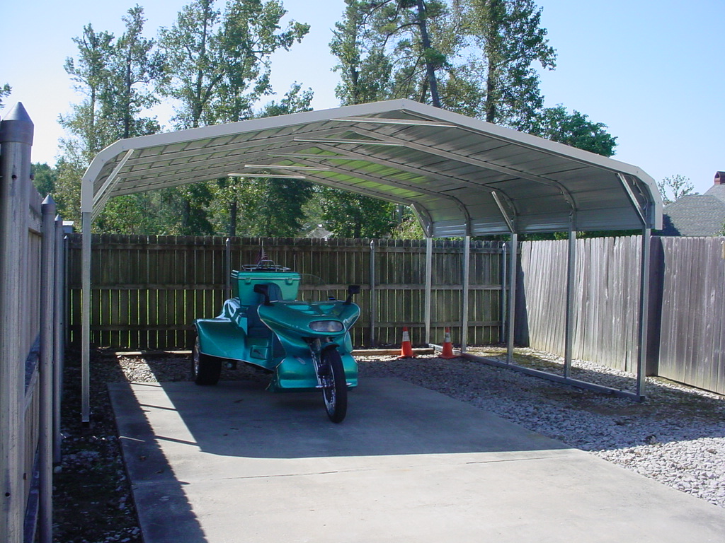 Motorcylce carport cover with white trim and room for two carports.