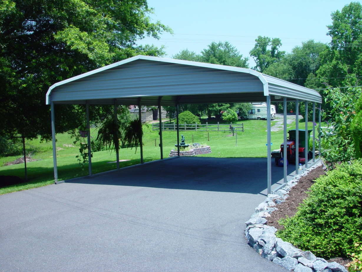 Grey double wide ski boat metal cover with gables and white trim.